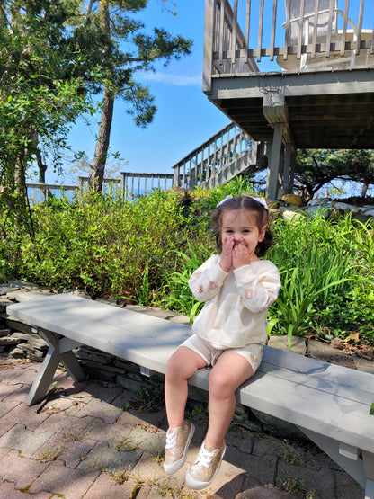 young girl wearing crewneck in kool summer pattern